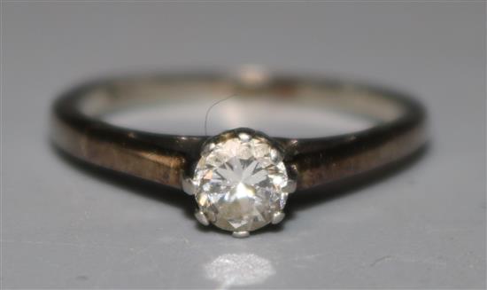 An 18ct white gold and solitaire diamond ring, size J.